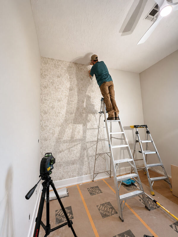 The first drop of the toile goes in at the ceiling line