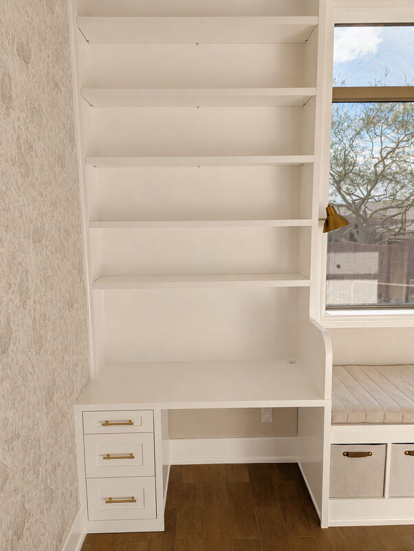 The desk return: five open shelves over a three-drawer base