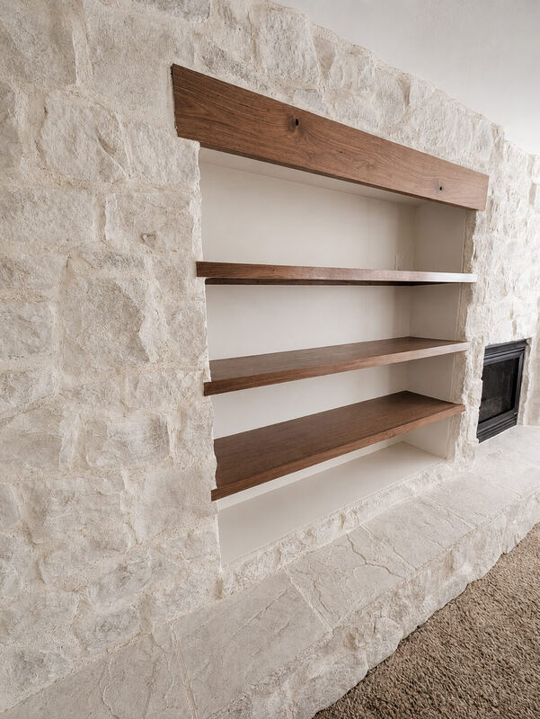 The niche, framed in washed stone