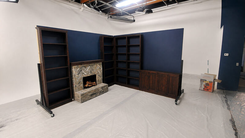 Navy flats on casters, carrying the bookcase run