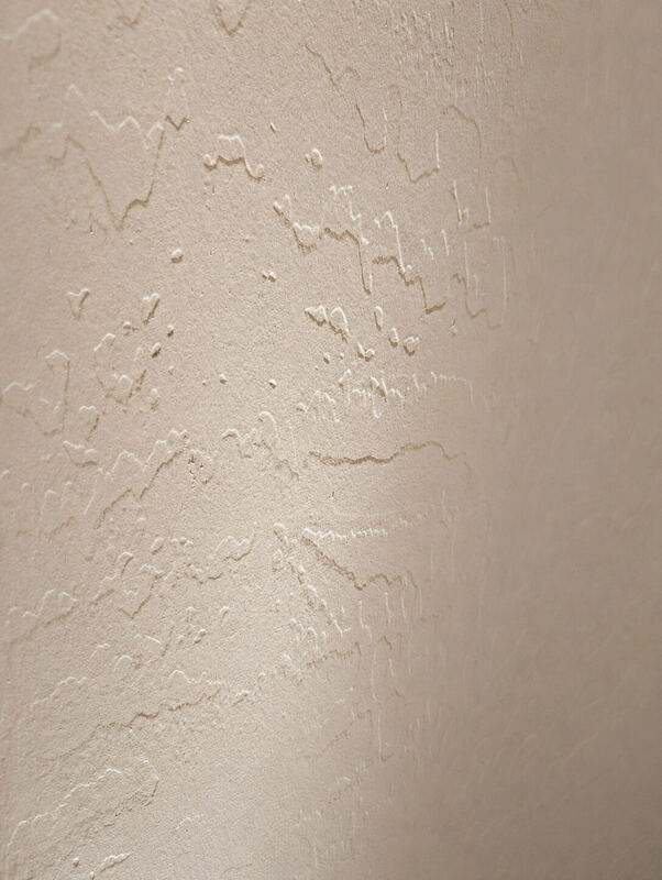 Raking light finds every ridge of the existing texture