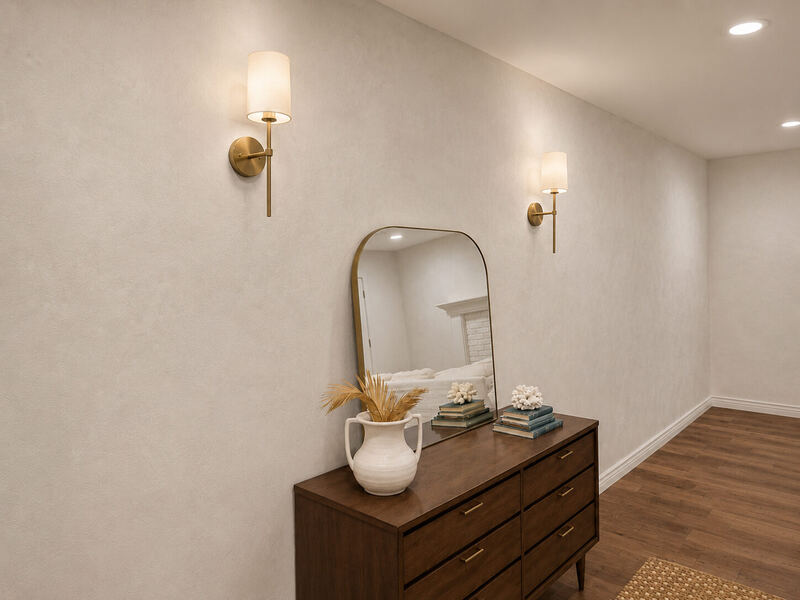 The entry side, with an arched brass mirror