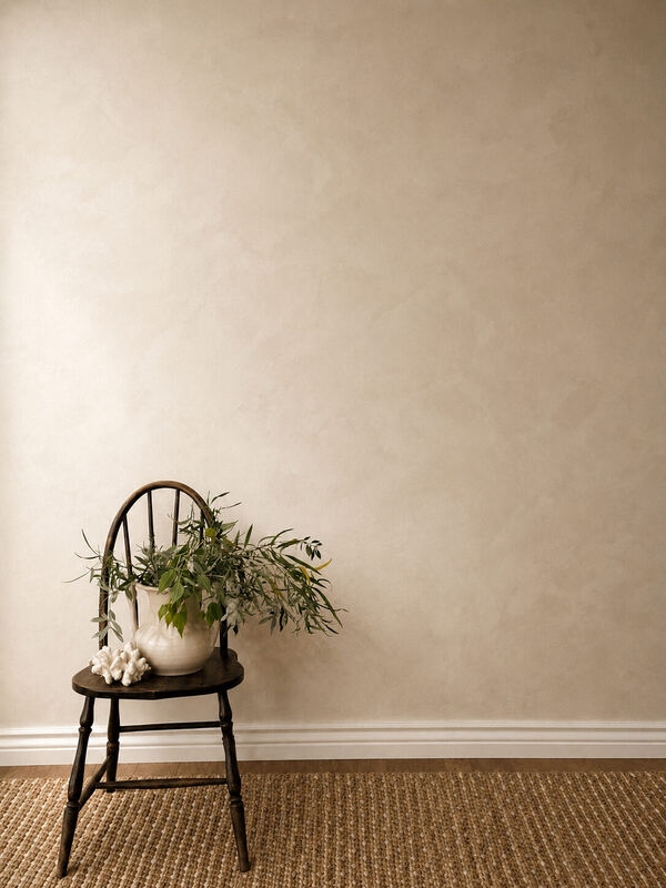 Mottled greige, and a black Windsor chair