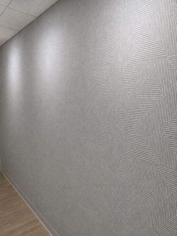 Raking light down the corridor — the whole run reads as one plane